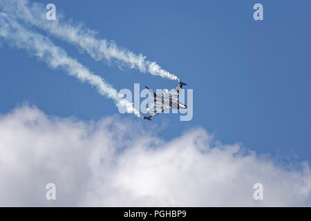 The Lockheed Martin F-16 fighter jet of the Belgian Solo Display Team puts on an immpressive flying display at the Royal International Air Tattoo Stock Photo
