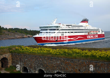 Helsinki, Finland - June 11, 2018: Cruiseferry Viking XPRS of Viking Line going to the port of Helsinki near Suomenlinna fortress. Suomenlinna is UNES Stock Photo