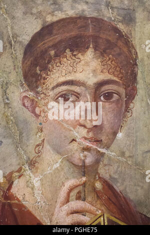 Portrait of a wife of Pompeian baker Terentius Neo, previously known as Paquius Proculus, depicted in the Roman fresco from Pompeii (20-30 AD), now on display in the National Archaeological Museum (Museo Archeologico Nazionale di Napoli) in Naples, Campania, Italy. The young woman poses with Roman writing implements (wax tablet and stylus). Stock Photo