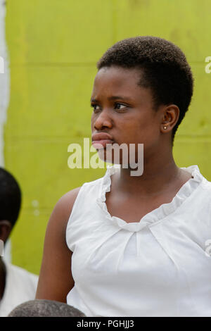 ACCRA, GHANA - Jan 8, 2017: Unidentified Ghanaian woman pouts at the local market. People of Ghana suffer of poverty due to the economic situation Stock Photo