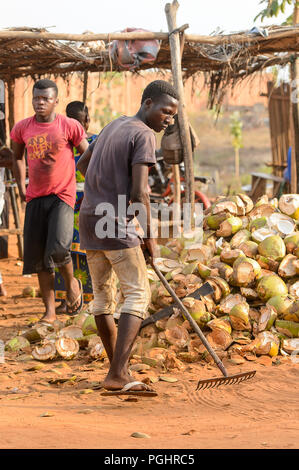 OUIDAH, BENIN - Jan 10, 2017: Unidentified Beninese man works at the local market. Benin people suffer of poverty due to the bad economy Stock Photo