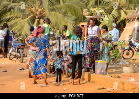 OUIDAH, BENIN - Jan 10, 2017: Unidentified Beninese people work at the local market. Benin people suffer of poverty due to the bad economy Stock Photo