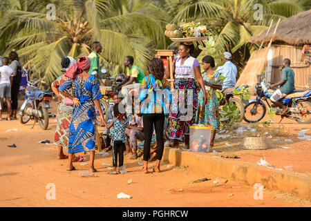 OUIDAH, BENIN - Jan 10, 2017: Unidentified Beninese people work at the local market. Benin people suffer of poverty due to the bad economy Stock Photo