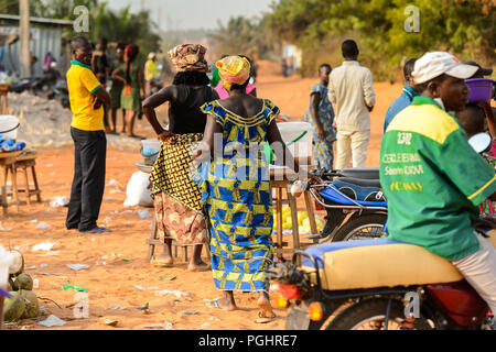 OUIDAH, BENIN - Jan 10, 2017: Unidentified Beninese people work at the local market. Benin people suffer of poverty due to the bad economy Stock Photo