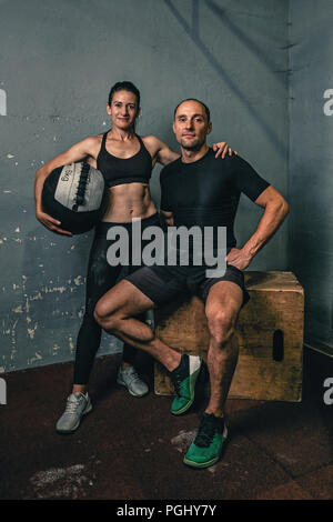 young sport couple, man and woman at the gym Stock Photo
