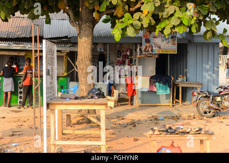 CENTRAL REGION, GHANA - Jan 17, 2017: Unidentified Ghanaian children near the barbershop in local village. Children of Ghana suffer of poverty due to  Stock Photo