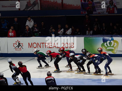 The team relay event at the ISU World Cup Short Track Speed Skating with the Italian, Chinese, Japanese and Dutch teams racing. Stock Photo