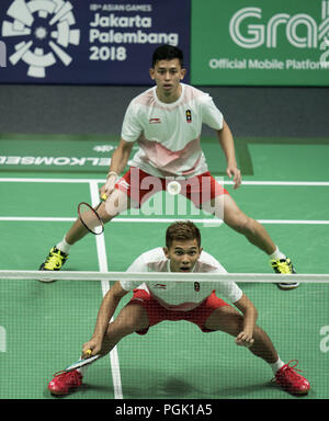 Jakarta. 27th Aug, 2018. Fajar Alfian (Front) and Muhammad Rian Ardianto of Indonesia compete with Li Junhui and Liu Yuchen of China during Men's Doubles semifinal of badminton at the 18th Asian Games in Jakarta, Indonesia on Aug. 27, 2018. Credit: Fei Maohua/Xinhua/Alamy Live News Stock Photo