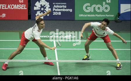 Jakarta. 27th Aug, 2018. Fajar Alfian (L) and Muhammad Rian Ardianto of Indonesia compete with Li Junhui and Liu Yuchen of China during Men's Doubles semifinal of badminton at the 18th Asian Games in Jakarta, Indonesia on Aug. 27, 2018. Credit: Fei Maohua/Xinhua/Alamy Live News Stock Photo