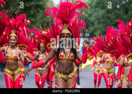 West London. UK. 27 Aug 2018 - Performers, revellers and carnival goers enjoy the annual Notting Hill Carnival. This is an annual celebration of London’s Caribbean communities, their culture and traditions, which takes places over two days and features a parade and live music, including reggae, dub and salsa. The Carnival is in its 52nd year and over a million people are expected to attend.   Credit: Dinendra Haria/Alamy Live News Stock Photo