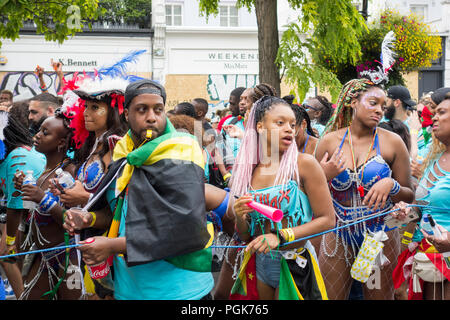 London, England, UK. 27th August, 2018.  Revellers at this year's Carnival in Notting Hill, London. © Benjamin John/ Alamy Live News. Stock Photo