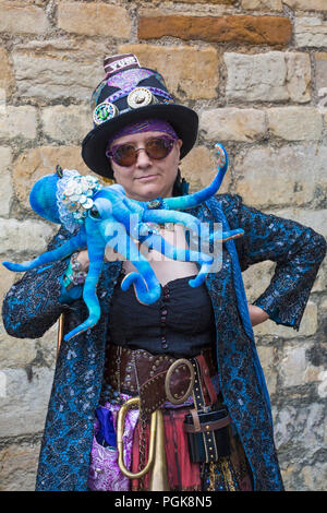 Lincoln, UK. 27th Aug 2018. The Asylum Steampunk Festival at Lincoln, in its 10th year, attracts visitors from all over the world. The biggest and longest steampunk festival in Europe, celebrates a steam powered world in the late 19th century, dressing in Victorian style with accessories that look like parts of machinery, cogs and gears. Credit: Carolyn Jenkins/Alamy Live News - Steampunk fashion, Steampunk clothing Stock Photo