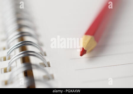 red pencil notebook close-up Stock Photo