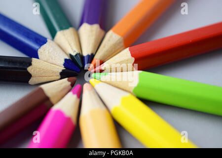 Many different colored pencils on gray background Stock Photo
