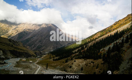 serpentine road to Barskoon pass, river and gorge and Sarymoynak pass at Jeti-Oguz, Kyrgyzstan Stock Photo