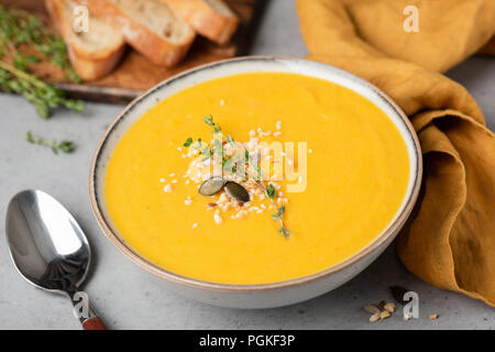 Cream of pumpkin soup. Vegan pumpkin soup in a bowl. Closeup view Stock Photo