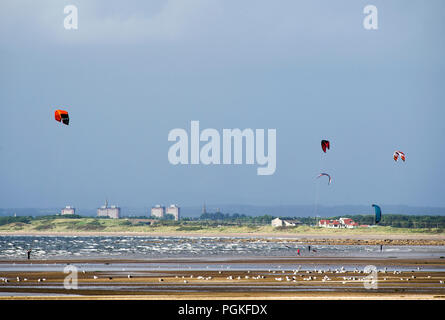 Kite boarders in action on North bay Troon Stock Photo