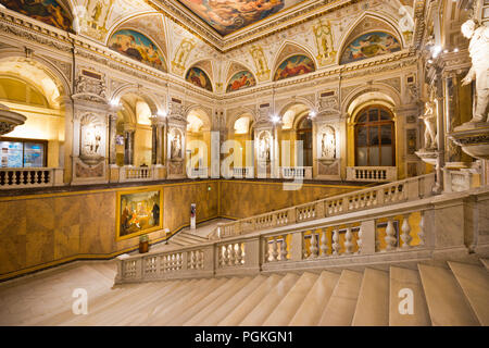 Sumptuous staircase with statues and round arches in imposing interior of famous Naturhistorisches Museum (natural history museum) in Vienna old town.
