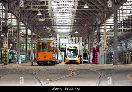 MILAN, ITALY - MAY 28, 2018: Trams parked at the tram depot in Pietro Custodi Street near Porta Ticinese ,May 2018 in Milan Stock Photo