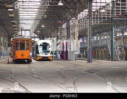 MILAN, ITALY - MAY 28, 2018: Trams parked at the tram depot in Pietro Custodi Street near Porta Ticinese ,May 2018 in Milan Stock Photo