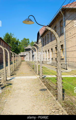 OSWIECIM, POLAND - JUNE 1, 2018: Double wired fences of concentration camp Stock Photo