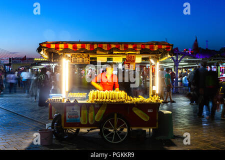 ISTANBUL, TURKEY - AUGUST 14: Street food vendor sells corn cobs and roasted chestnuts on the street of Istanbul on August 14, 2018 in Istanbul, Turke Stock Photo