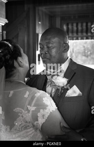 Mixed race older couple dancing Stock Photo