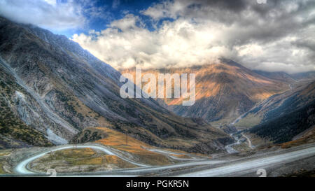 serpentine road to Barskoon pass, river and gorge and Sarymoynak pass at Jeti-Oguz, Kyrgyzstan Stock Photo