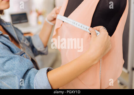 Woman measuring her chest stock image. Image of dressmaker - 176151589