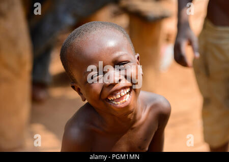 PIRA, BENIN - JAN 12, 2017: Unidentified Beninese little boy smiles. Benin children suffer of poverty due to the bad economy. Stock Photo