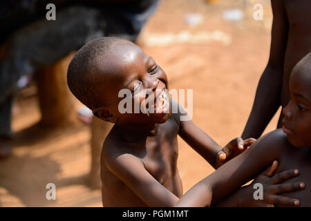 PIRA, BENIN - JAN 12, 2017: Unidentified Beninese little boy smiles. Benin children suffer of poverty due to the bad economy. Stock Photo