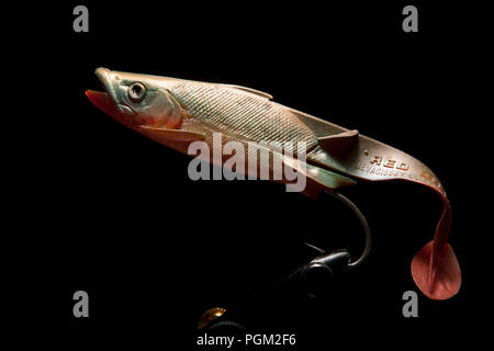 An old rubber Red Gill of Mevagissey Cornwall sea fishing lure designed for catching predatory fish such as pollack or cod. From a collection of fishi Stock Photo