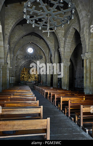 Ex-Collegiate Church of Santa María with a fortified aspect and Romanesque ogee style in Baiona, Galicia, Spain, Europe Stock Photo