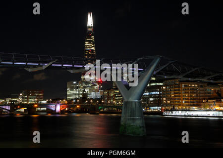 The Millennium Bridge and The shard, London, at night Stock Photo