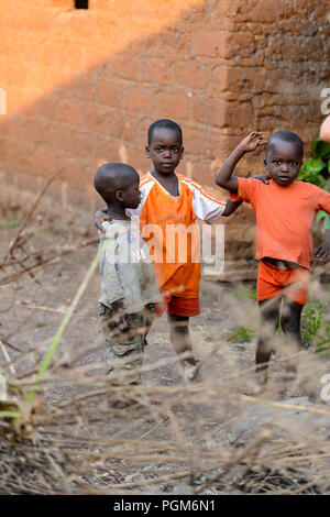 MASSIF KABYE, TOGO - JAN 13, 2017: Unidentified Togolese  children stand in the village. Togo children suffer of poverty due to the bad economy. Stock Photo