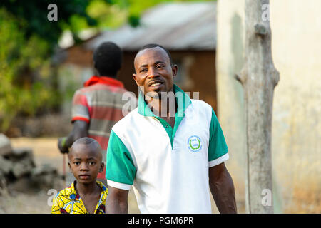 MASSIF KABYE, TOGO - JAN 13, 2017: Unidentified Togolese man smiles in the village. Togo people suffer of poverty due to the bad economy. Stock Photo