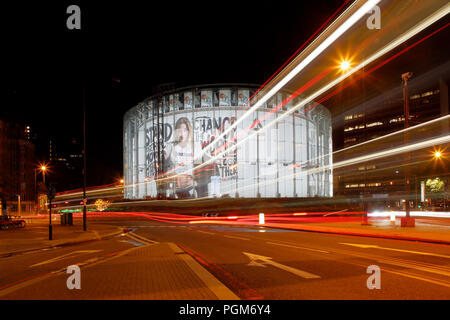 London BFI IMAX cinema at Waterloo, photographed at night, long exposure to include light trails left by passing traffic. Stock Photo