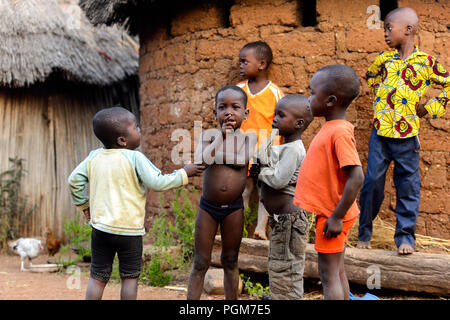 MASSIF KABYE, TOGO - JAN 13, 2017: Unidentified Togolese  children play in the village. Togo children suffer of poverty due to the bad economy. Stock Photo