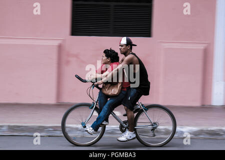 Couple riding bicycle in Granada, Nicaragua, Central America Stock Photo