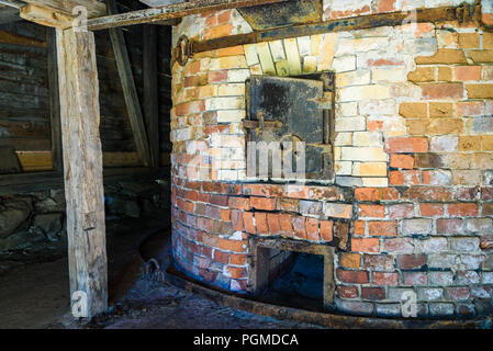 Large vintage brick kiln in old industrial building. Stock Photo