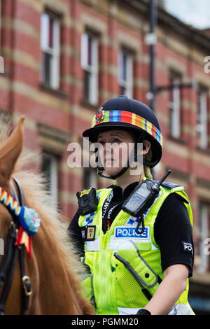 Female Greater Manchester Mounted Police Officers showing their support for the LGBT community as they take part in the 2018 Manchester Pride Parade. Stock Photo