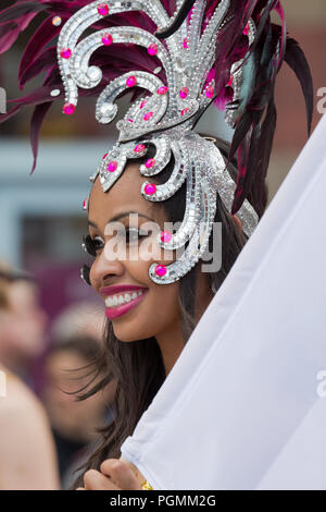 Beautiful black woman with carnival headgear takes part in the 2018 Manchester Pride Parade. Stock Photo