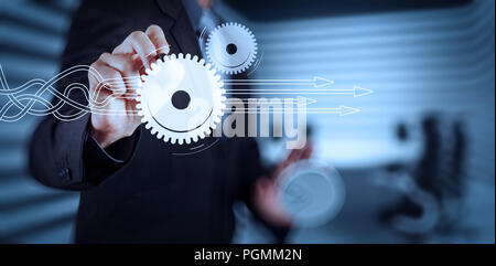 Thinking about structuring virtual diagram of business process with solutions. Businessman hand pressing an imaginary button on virtual screen Stock Photo