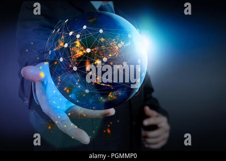 Hand holding Global world telecommunication network connected around planet Earth for internet and worldwide communication technology about finance Stock Photo