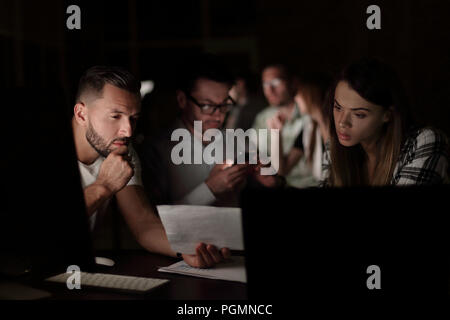 business team uses gadgets to solve the problem Stock Photo