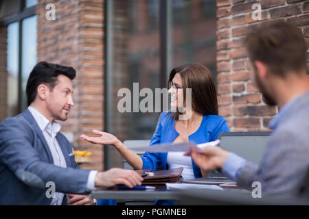 business colleagues discuss business issues, sitting at the table cafe.concept. Stock Photo