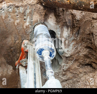 Diamond drilling machine hole in the concrete Stock Photo