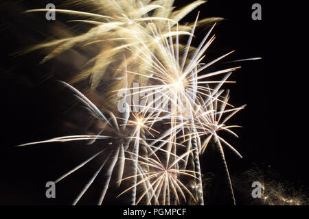 golden and silver sparkle shining fireworks, fireworks effect on dark sky background Stock Photo