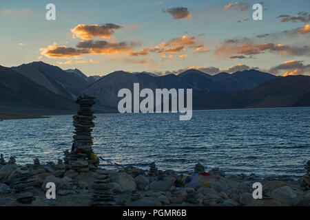 Stones stacked on each other at Pangong Tso in Ladakh, India Stock Photo