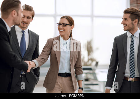 business people reach out to each other.the concept of cooperation Stock Photo